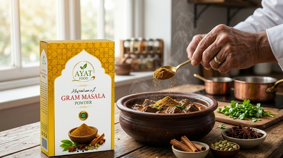 Garam masala powder being sprinkled into a simmering curry